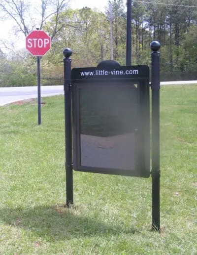 Outdoor message center with top panel