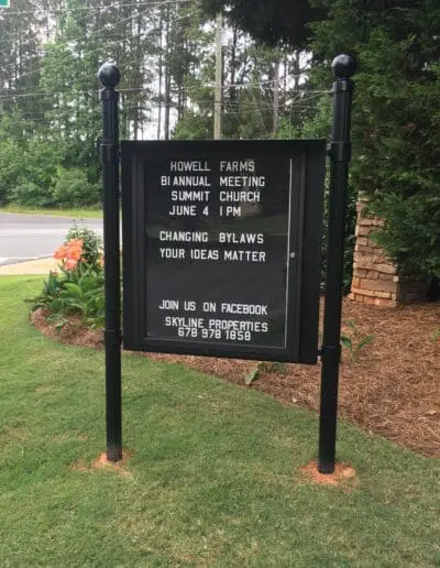 Outdoor Message Center with white letters on letterboard insert